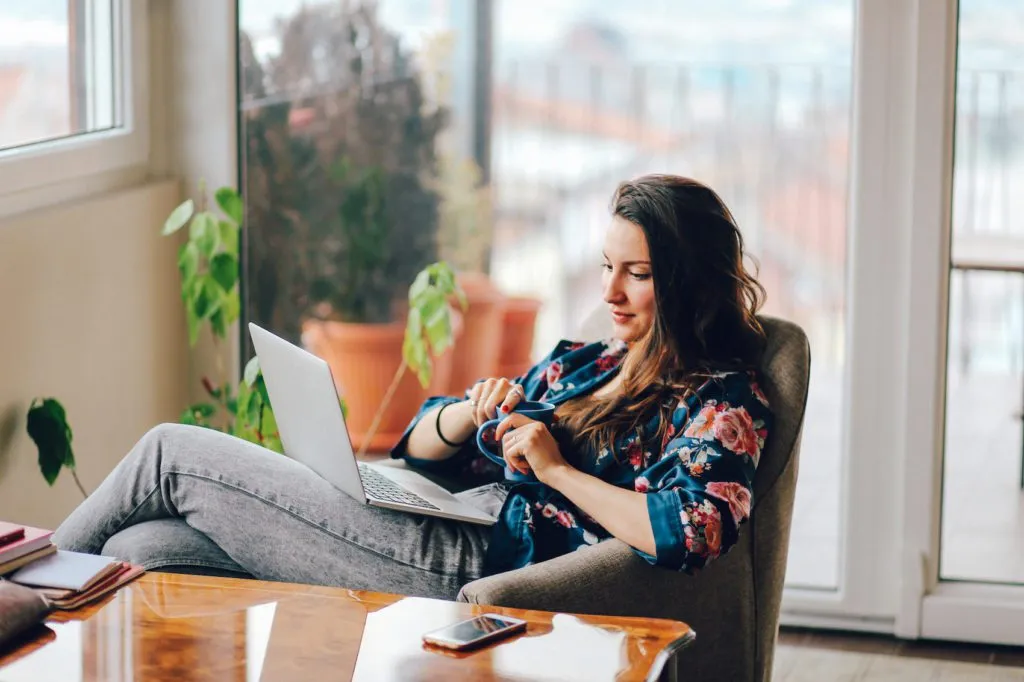 young woman at woman on her laptop